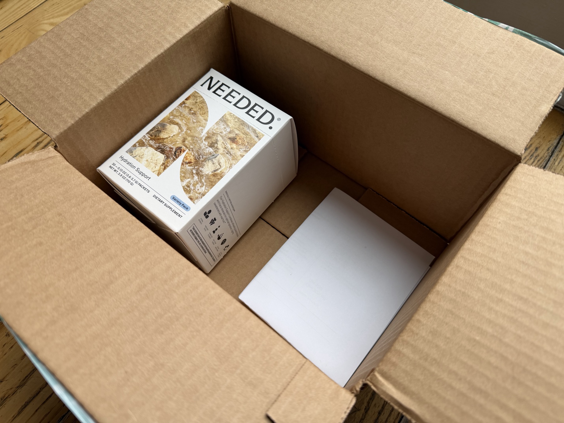 One Needed product box inside a much larger shipping carton
